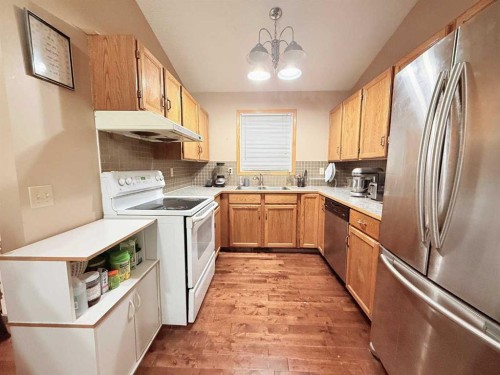 6946 Laguna Way Ne, Calgary, AB - Indoor Photo Showing Kitchen With Double Sink