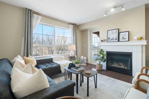 408-5115 Richard Road Sw, Calgary, AB - Indoor Photo Showing Living Room With Fireplace