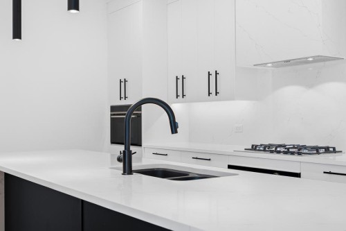 112-835 78 Street Sw, Calgary, AB - Indoor Photo Showing Kitchen With Double Sink