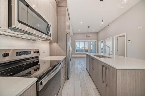 2613-60 Skyview Ranch Road Ne, Calgary, AB - Indoor Photo Showing Kitchen With Double Sink With Upgraded Kitchen