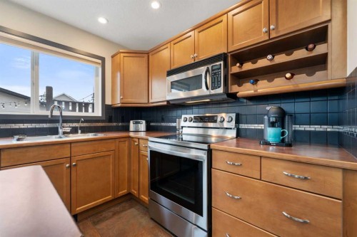 44 Cranberry Way Se, Calgary, AB - Indoor Photo Showing Kitchen With Double Sink