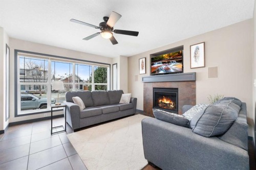 44 Cranberry Way Se, Calgary, AB - Indoor Photo Showing Living Room With Fireplace
