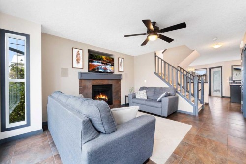 44 Cranberry Way Se, Calgary, AB - Indoor Photo Showing Living Room With Fireplace