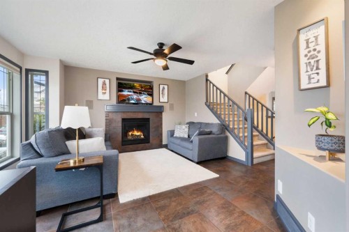 44 Cranberry Way Se, Calgary, AB - Indoor Photo Showing Living Room With Fireplace