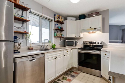 3313-20 Harvest Rose Park Ne, Calgary, AB - Indoor Photo Showing Kitchen With Double Sink