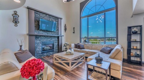 155 Coral Shores Landing Ne, Calgary, AB - Indoor Photo Showing Living Room With Fireplace