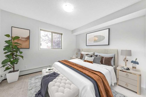 9113-403 Mackenzie Way Sw, Airdrie, AB - Indoor Photo Showing Bedroom
