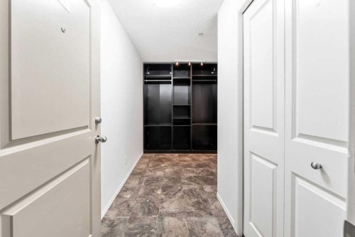 9113-403 Mackenzie Way Sw, Airdrie, AB - Indoor Photo Showing Other Room