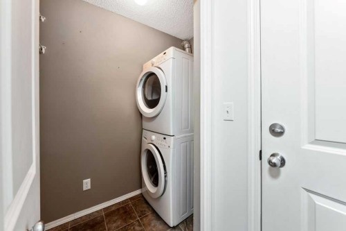 9113-403 Mackenzie Way Sw, Airdrie, AB - Indoor Photo Showing Laundry Room