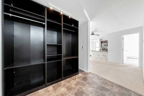 9113-403 Mackenzie Way Sw, Airdrie, AB - Indoor Photo Showing Other Room