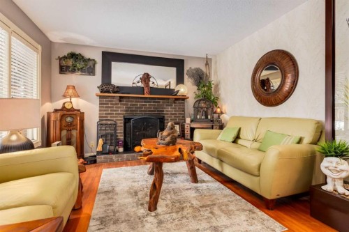 21 Midridge Green Se, Calgary, AB - Indoor Photo Showing Living Room With Fireplace