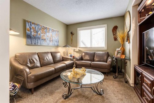 21 Midridge Green Se, Calgary, AB - Indoor Photo Showing Living Room