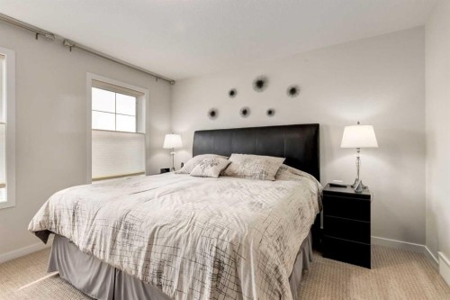 165 Sundown Road, Cochrane, AB - Indoor Photo Showing Bedroom