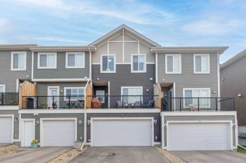 165 Sundown Road, Cochrane, AB - Outdoor With Facade