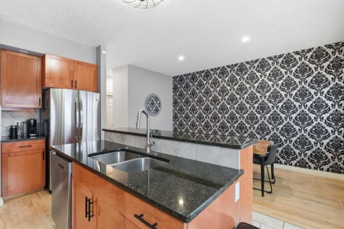 45 Somme Boulevard Sw, Calgary, AB - Indoor Photo Showing Kitchen With Stainless Steel Kitchen With Double Sink