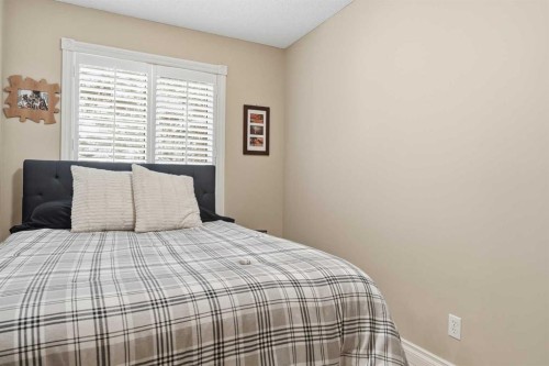 45 Somme Boulevard Sw, Calgary, AB - Indoor Photo Showing Bedroom