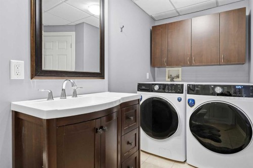 45 Somme Boulevard Sw, Calgary, AB - Indoor Photo Showing Laundry Room
