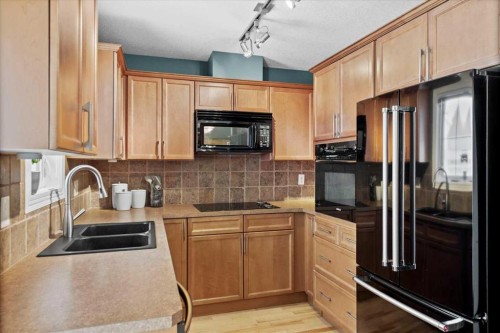 8910 Royal Oak Way Nw, Calgary, AB - Indoor Photo Showing Kitchen With Double Sink