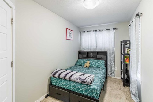 228 Red Embers Way Ne, Calgary, AB - Indoor Photo Showing Bedroom