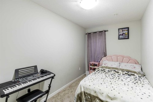 228 Red Embers Way Ne, Calgary, AB - Indoor Photo Showing Bedroom
