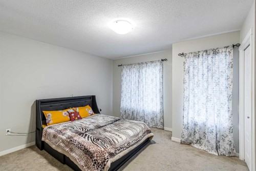 228 Red Embers Way Ne, Calgary, AB - Indoor Photo Showing Bedroom