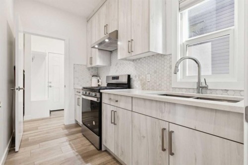 51 Midgrove Drive Sw, Airdrie, AB - Indoor Photo Showing Kitchen With Upgraded Kitchen