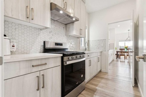 51 Midgrove Drive Sw, Airdrie, AB - Indoor Photo Showing Kitchen With Upgraded Kitchen
