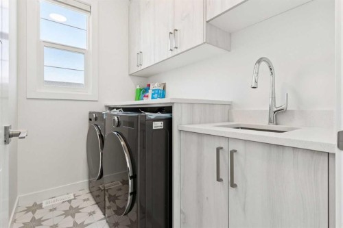 51 Midgrove Drive Sw, Airdrie, AB - Indoor Photo Showing Laundry Room