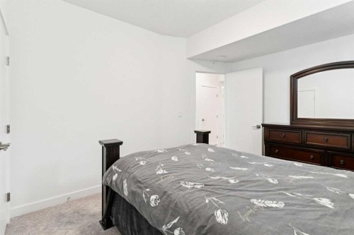 51 Midgrove Drive Sw, Airdrie, AB - Indoor Photo Showing Bedroom