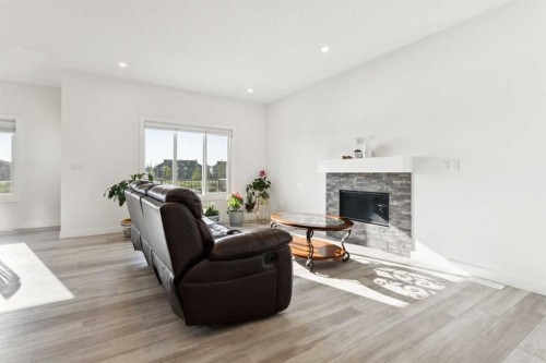 51 Midgrove Drive Sw, Airdrie, AB - Indoor Photo Showing Living Room With Fireplace