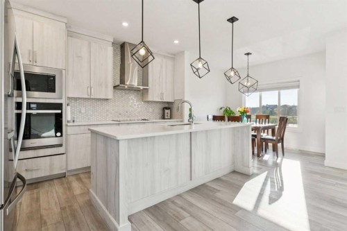 51 Midgrove Drive Sw, Airdrie, AB - Indoor Photo Showing Kitchen With Upgraded Kitchen