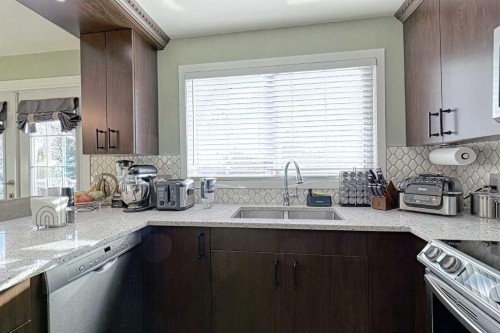 4728 Rundlehorn Drive Ne, Calgary, AB - Indoor Photo Showing Kitchen With Double Sink