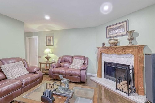 4728 Rundlehorn Drive Ne, Calgary, AB - Indoor Photo Showing Living Room With Fireplace