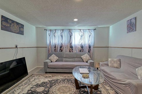 4728 Rundlehorn Drive Ne, Calgary, AB - Indoor Photo Showing Living Room