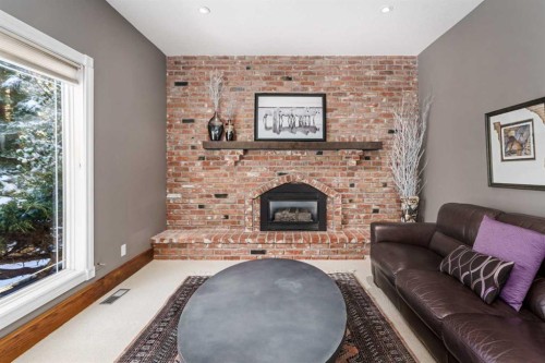 215 Edgemont Place Nw, Calgary, AB - Indoor Photo Showing Living Room With Fireplace