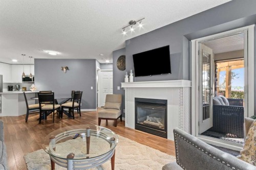 116-5115 Richard Road Sw, Calgary, AB - Indoor Photo Showing Living Room With Fireplace