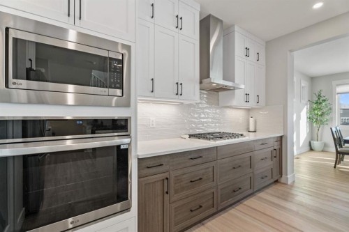 235 Chelsea Park, Chestermere, AB - Indoor Photo Showing Kitchen With Upgraded Kitchen