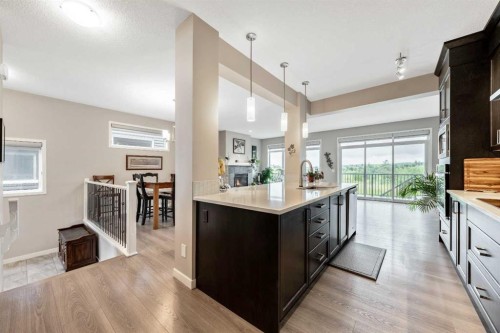 75 Fireside Crescent, Cochrane, AB - Indoor Photo Showing Kitchen With Upgraded Kitchen