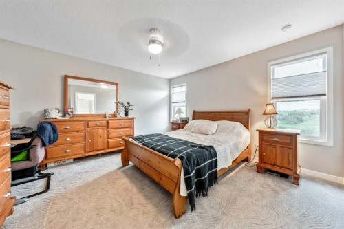 75 Fireside Crescent, Cochrane, AB - Indoor Photo Showing Bedroom