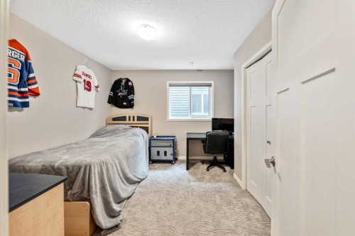 75 Fireside Crescent, Cochrane, AB - Indoor Photo Showing Bedroom