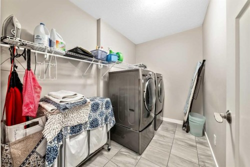 75 Fireside Crescent, Cochrane, AB - Indoor Photo Showing Laundry Room