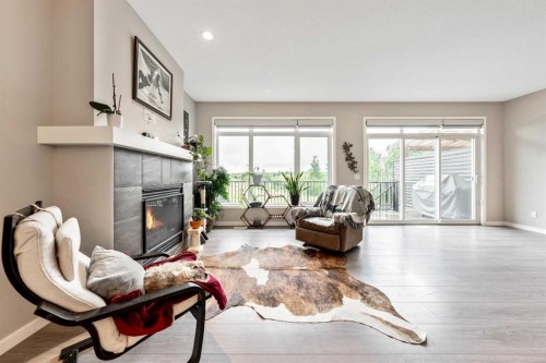 75 Fireside Crescent, Cochrane, AB - Indoor Photo Showing Living Room With Fireplace
