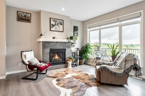 75 Fireside Crescent, Cochrane, AB - Indoor Photo Showing Living Room With Fireplace