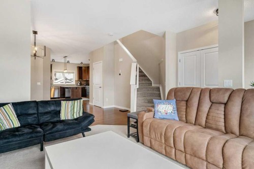 24 Copperpond Park Se, Calgary, AB - Indoor Photo Showing Living Room