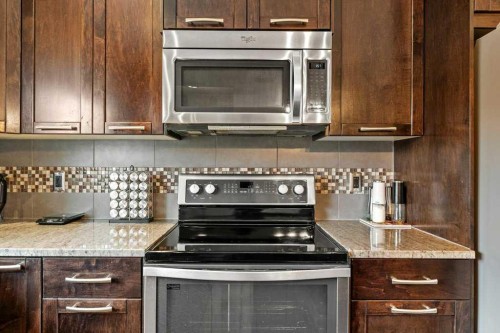 24 Copperpond Park Se, Calgary, AB - Indoor Photo Showing Kitchen With Stainless Steel Kitchen With Upgraded Kitchen