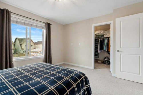 24 Copperpond Park Se, Calgary, AB - Indoor Photo Showing Bedroom