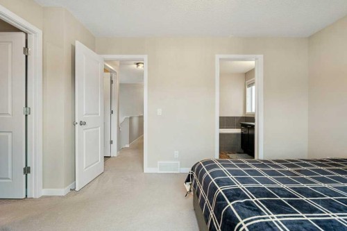 24 Copperpond Park Se, Calgary, AB - Indoor Photo Showing Bedroom