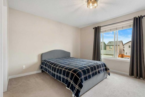 24 Copperpond Park Se, Calgary, AB - Indoor Photo Showing Bedroom