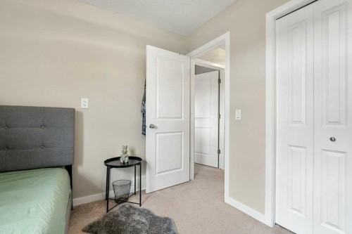 24 Copperpond Park Se, Calgary, AB - Indoor Photo Showing Bedroom