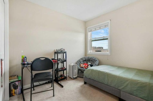 24 Copperpond Park Se, Calgary, AB - Indoor Photo Showing Bedroom